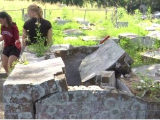 Volunteers work to clean up blighted historic Black cemetery