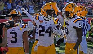 WATCH: LSU players laid down in the Cheez-It bed after a big play. A coach wasn't having it.