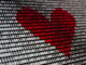 Red heart made out of binary digits - Unsplash
