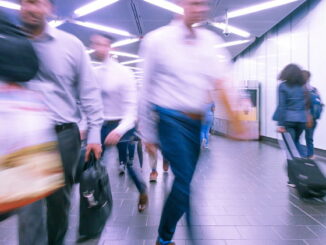 People rushing on a subway platform - Unsplash
