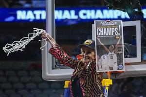 LSU's Kim Mulkey cut down the nets after winning the title in Dallas. Check out the video.