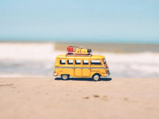 A toy VW bus on a beach - Pexels