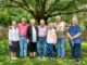 More than 60 Pittman descendants gather under Jackson oak trees to share family history